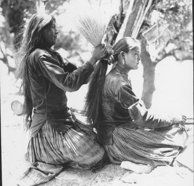 Navajo Woman Tying her Daughter's Hair